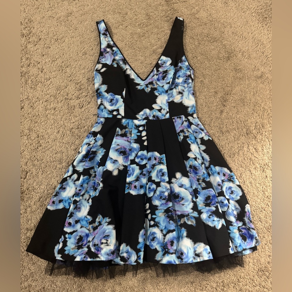 Bebe black and blue floral deep v neck dress. Size M
